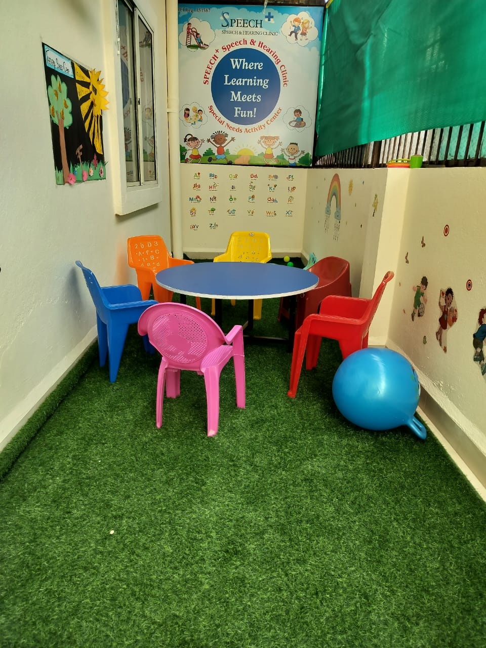 Special Kids Activity Center room with child-sized table and colorful chairs